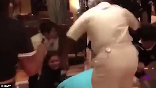 At one point during the footage a member of cruise staff attempts to stop the person behind the camera from filming the incident