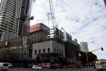 A crane towers over apartments under construction in Melbourne.