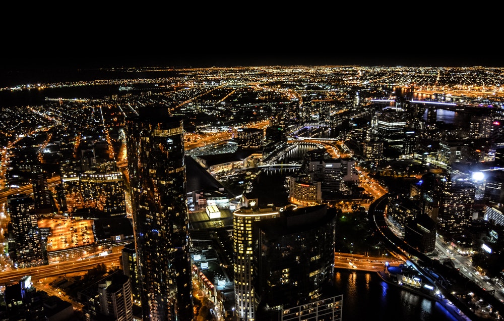 aerial photography of skyscraper at night time