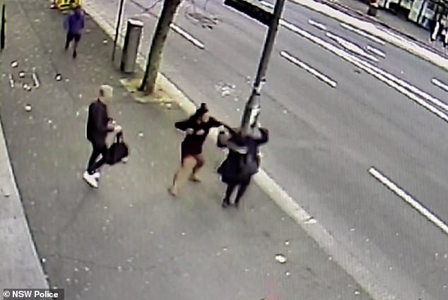 A woman can be seen punching a heavily pregnant victim on Wentworth Avenue in Sydney's inner west on Tuesday morning in an alleged unprovoked attack