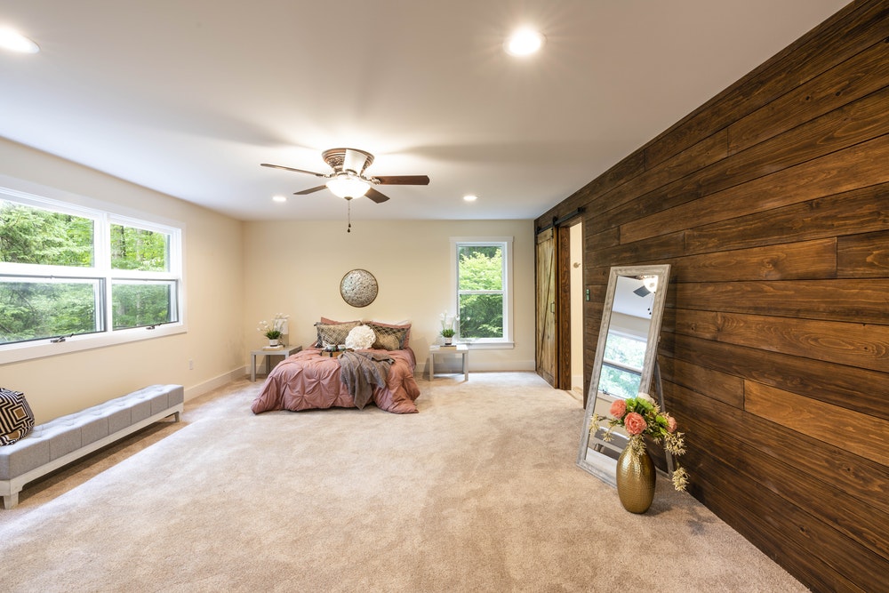 empty bedroom with turned-on lights