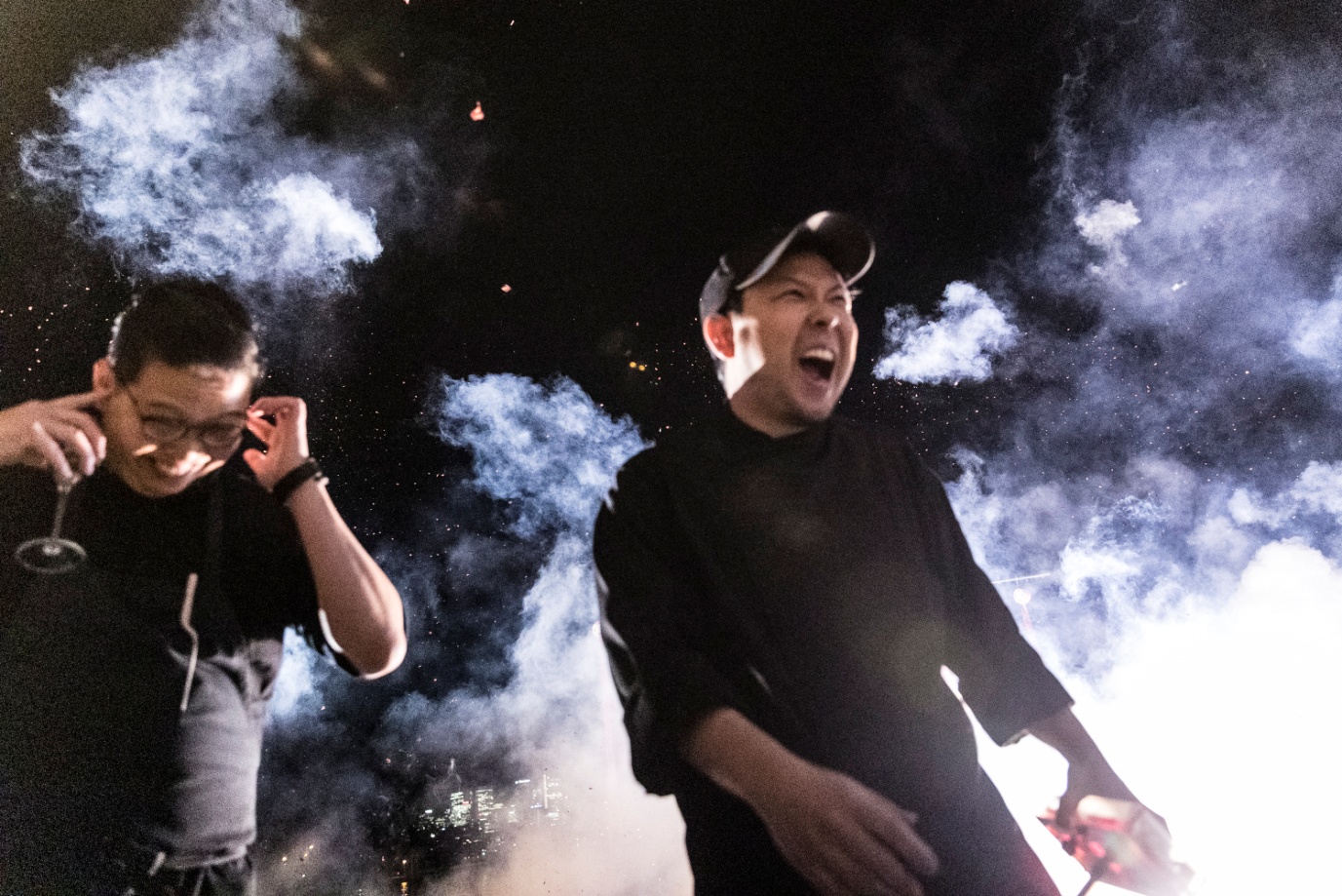 E:\655-20190727\Draft\01. B section\Cuisine\B11\CHUUKA chefs Chase Kojima and Victor Liong letting off firecrackers at the launch party.jpg