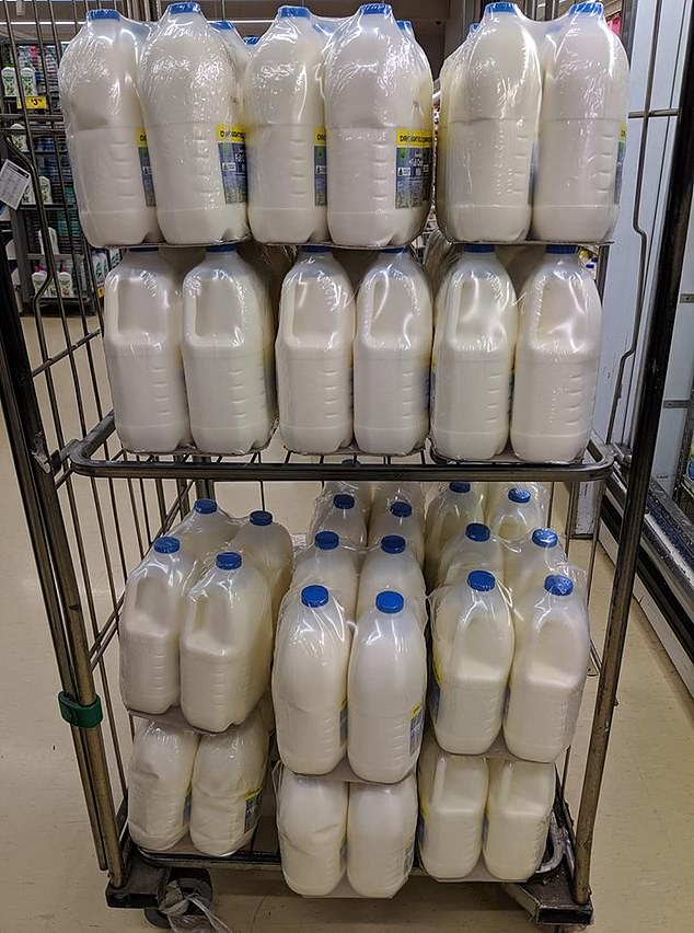 Three litre milk bottles on a storage trolley where all the milk bottles were wrapped in plastic