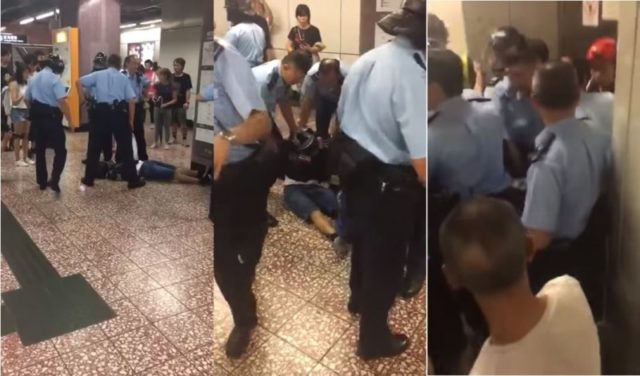 港鐵太子站一名青年被警察壓制，疑似頸椎受傷。港警不顧該名青年傷勢強行拖拽引發現場民眾不滿將警察團團圍住 視頻截圖